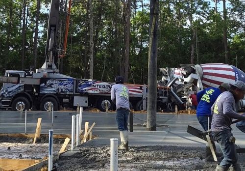 Concrete pump truck and mixer on site